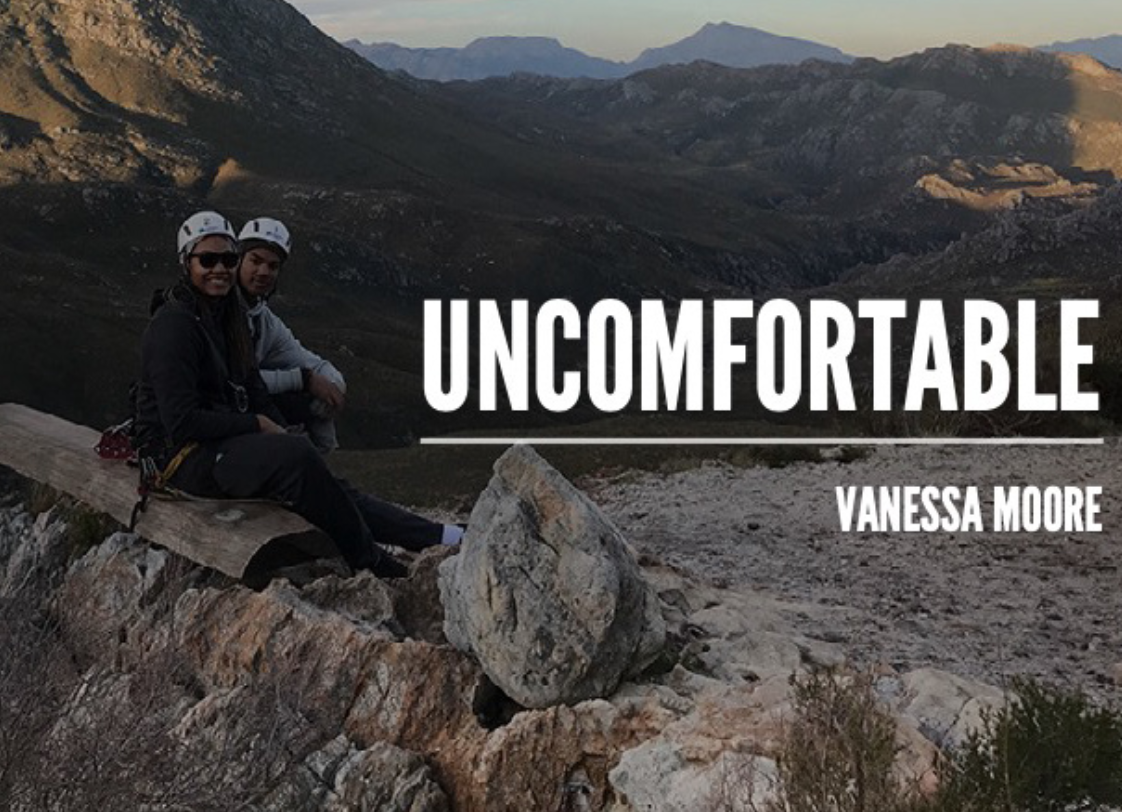 Young Women Sitting On Mountain